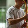 Rehabilitation coach assisting client with resistance band